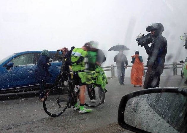 Racers stops in snow to put on warmer clothing